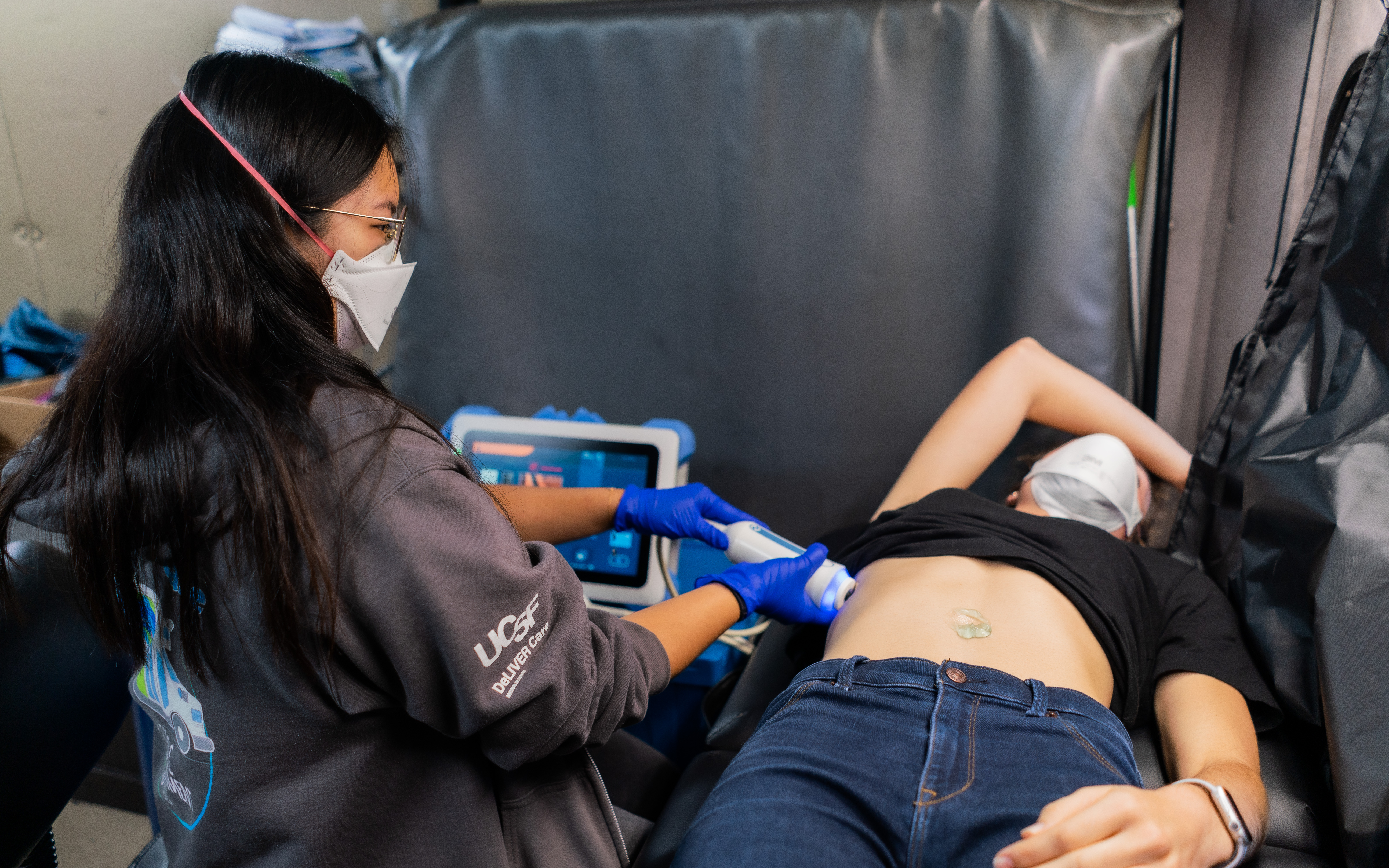 Kyoko performing fibroscan on patient